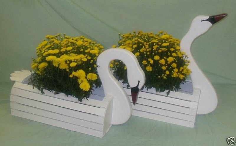 male & female wooden swan planters  